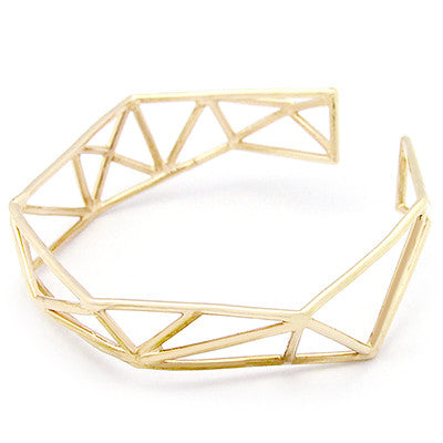 Geometric gold bangle with open, angular design.