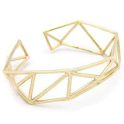 Unique gold bangle with geometric design.