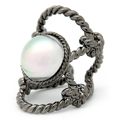 Silver ring with a large costume pearl surrounded by twisted rope design.