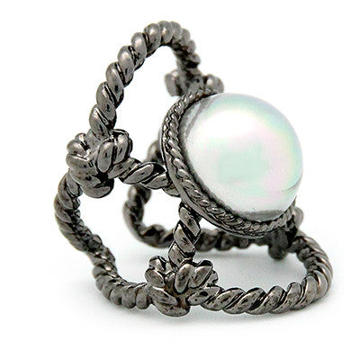 Unique ring with a large costume pearl surrounded by twisted rope design.