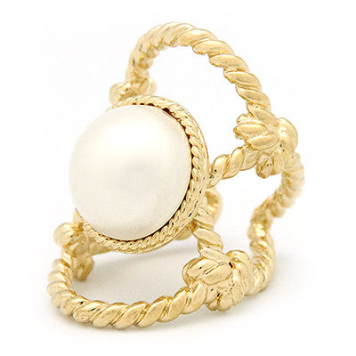 Elegant gold ring with a large costume pearl surrounded by twisted rope design.