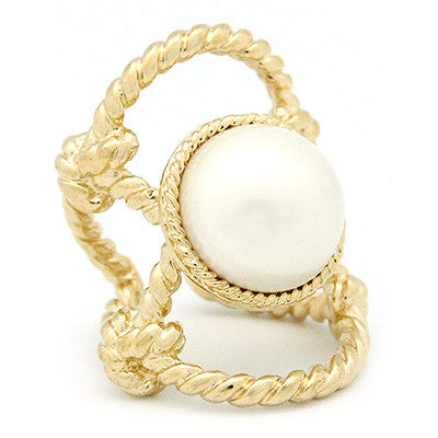 Stunning gold ring with a large costume pearl surrounded by twisted rope design.