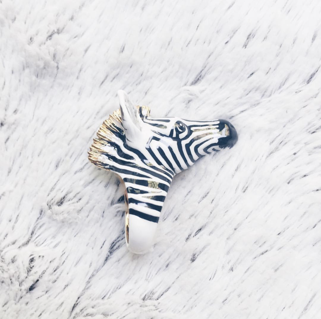 Stylish zebra ring showcasing intricate detailing and a modern design.