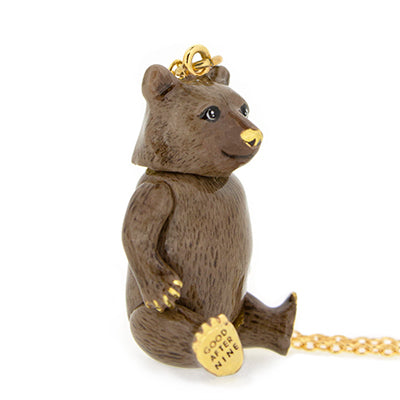 Golden necklace featuring a bear-shaped pendant, perfect for animal loves.