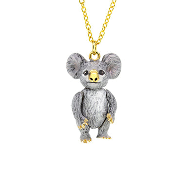 A cute grey koala pendant with large ears and a gold nose, with a gold chain necklace.