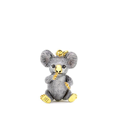 A cute grey koala pendant with large ears and a gold nose, with a gold chain necklace.