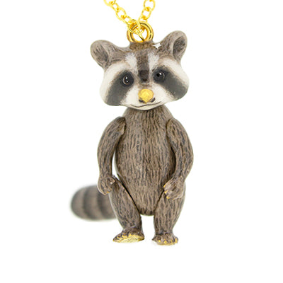 Raccoon pendant on a gold chain, featuring a cute design with intricate details.