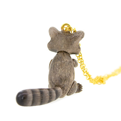 Raccoon pendant on a gold chain, featuring a cute design with intricate details, perfect for animal lovers.