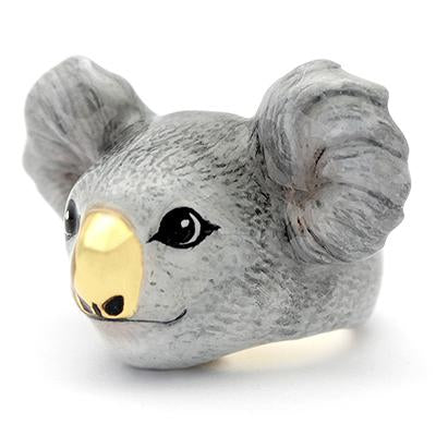 A charming ring featuring a koala's face, featuring detailed ears and a shiny gold nose.