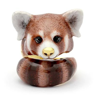 Adorable ring designed as a red panda's head, featuring detailed eyes and a nose 
