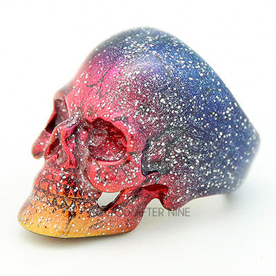 Artistic skull ring inspired by the galaxy with vibrant colors.