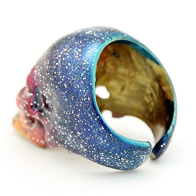 Artistic skull ring inspired by the galaxy with vibrant colors.