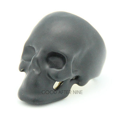 Unique black skull ring with hollow eye sockets and detailed features