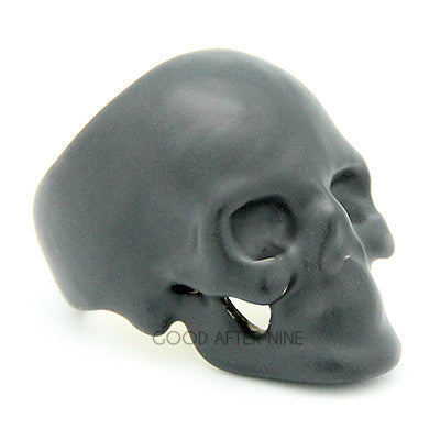 Handcrafted black skull ring with hollow eye sockets and detailed features