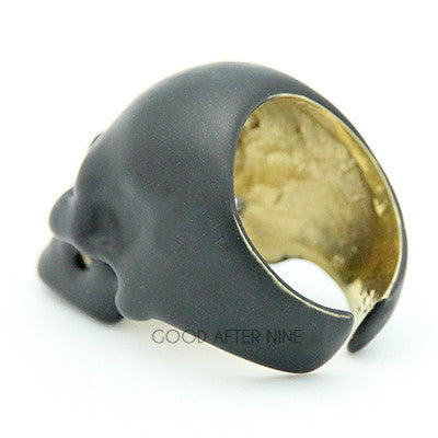 Stylish black skull ring with hollow eye sockets and detailed features