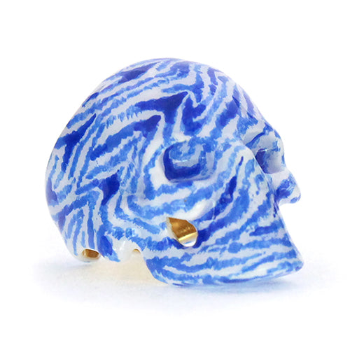 Hand-painted skull ring featuring a unique zebra pattern in blue and white.