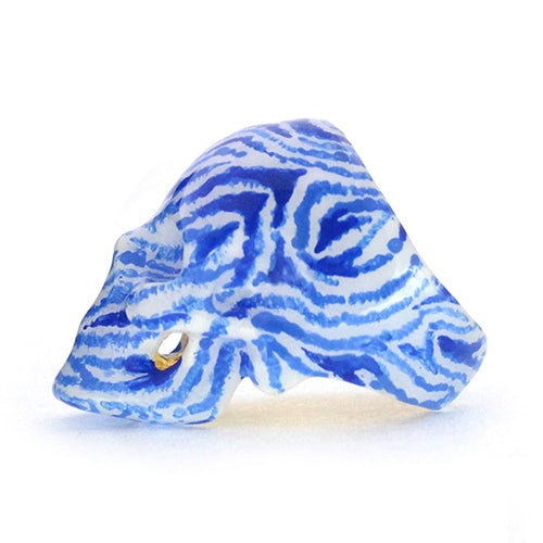 Hand-painted skull ring featuring a unique zebra pattern in blue and white.