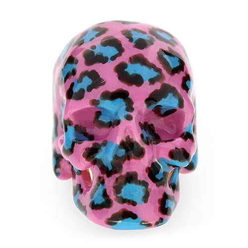 A vibrant skull ring featuring a pink base with a leopard pattern in black and blue