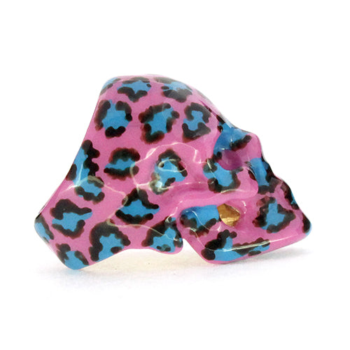 Unique skull ring featuring a pink base with a leopard pattern in black and blue
