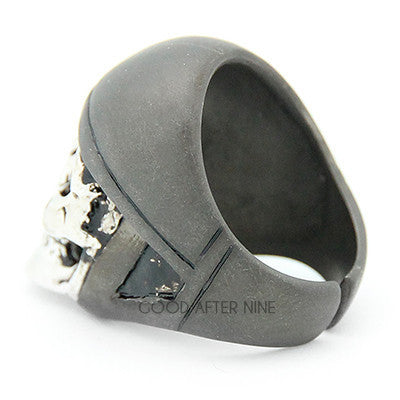 Handcrafted skull ring featuring a realistic skull design topped with a grey helmet.