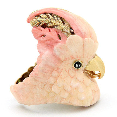 Beautiful cockatoo-shaped ring in soft pink and gold tones, perfect for bird lovers.