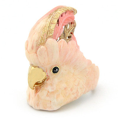 Unique cockatoo-shaped ring in soft pink and gold tones, perfect for animal lovers.