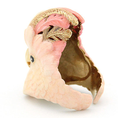 Unique cockatoo-shaped ring in soft pink and gold tones, perfect for animal lovers.