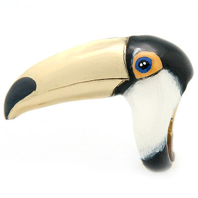 Bird ring featuring a toucan's head in black, white, and gold.