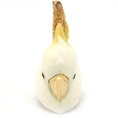 Handcrafted bird ring featuring cockatoo design with white and yellow details.