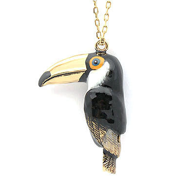 Charming toucan-shaped whistle necklace with a gold chain.