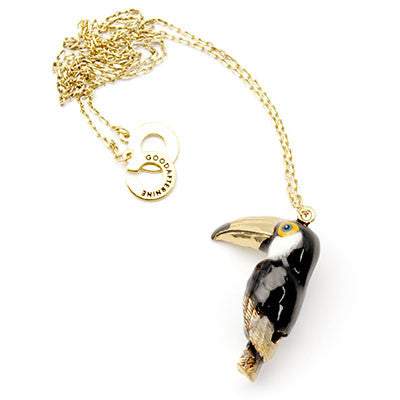 Adorable toucan-shaped whistle necklace with a gold chain, perfect for animal lovers.