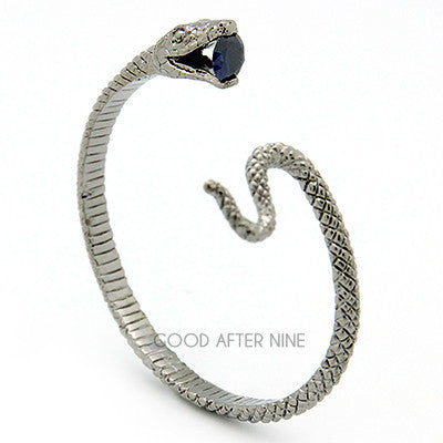 Beautifully crafted snake bangle with a blue gemstone at its mouth