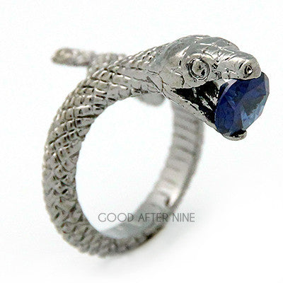 Handcrafted snake ring, displaying detailed textures with a blue gemstone at its mouth.