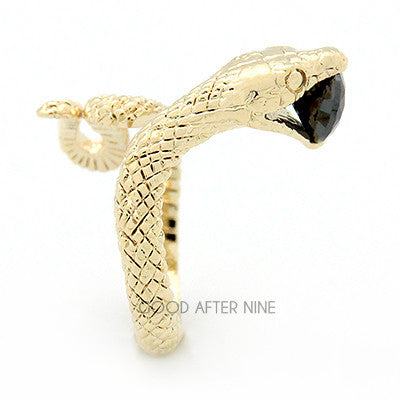 Beautiful gold ring featuring snake design with a blue gemstone in its mouth, perfect for unique jewelry lovers.