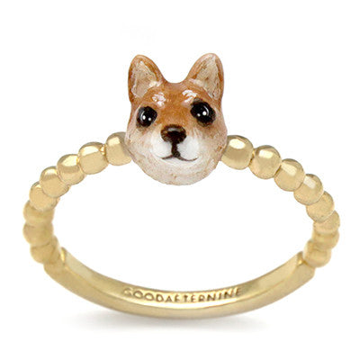 Gold ring featuring a cute dog head design