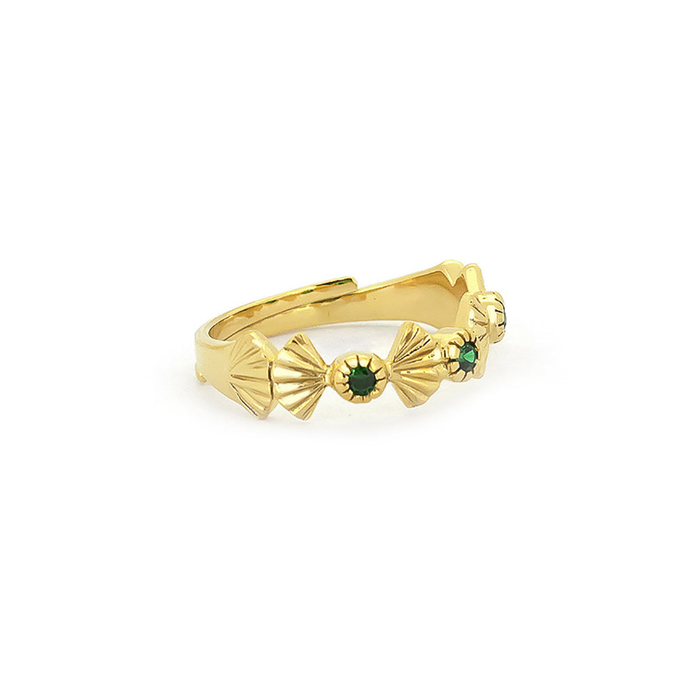 Unique gold ring featuring intricate details and green stones.