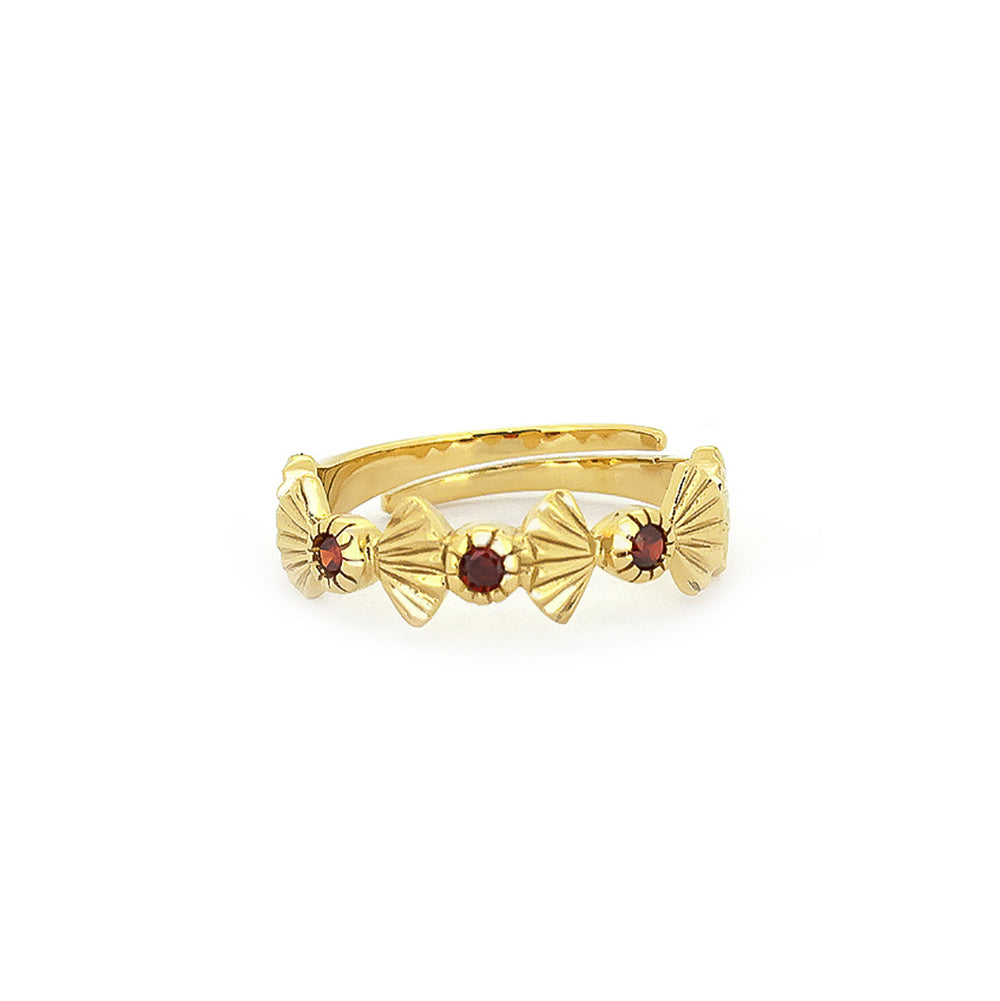 Artisan-crafted gold ring featuring garnet stones and intricate design