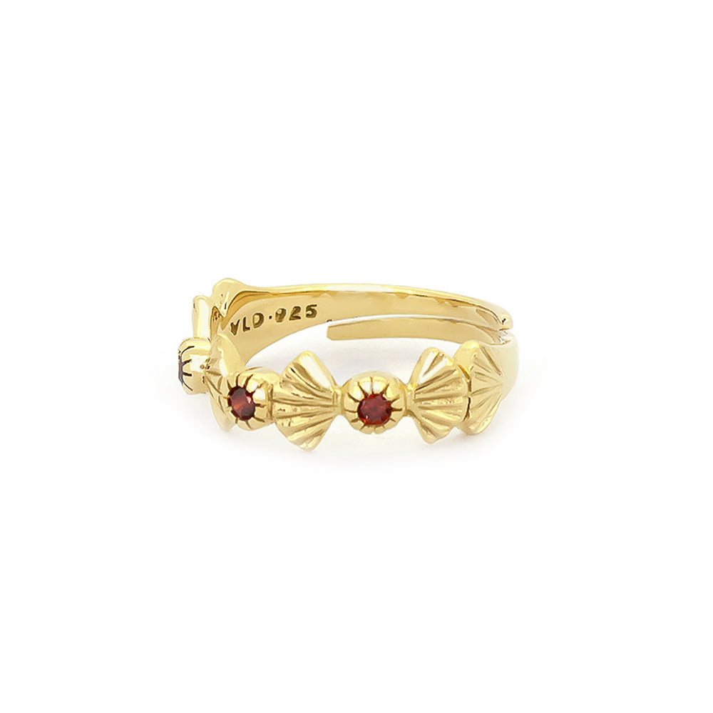 Artisan-crafted gold ring featuring garnet stones and intricate design