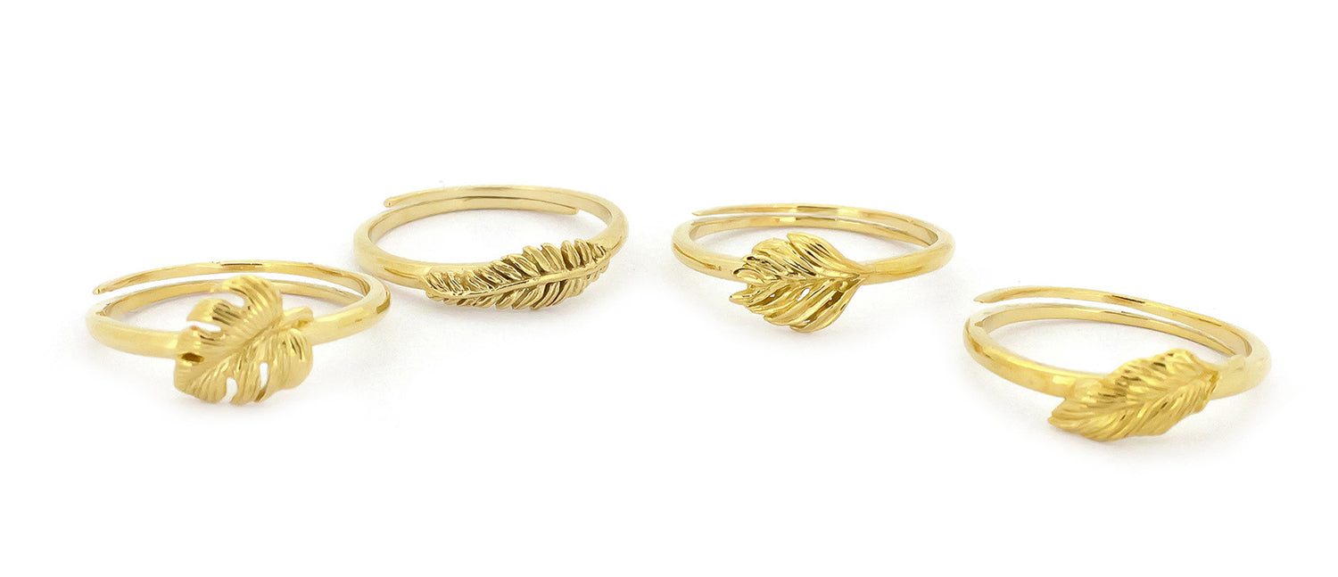 Nature-inspired gold rings showcasing beautiful leaf designs.