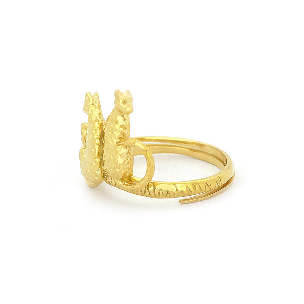 A golden ring featuring two stylized leopards facing each other, adorned with textured detailing and ornate band.