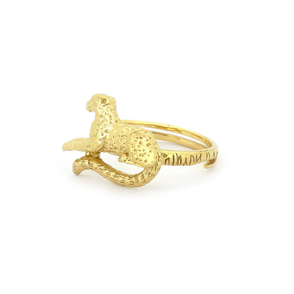 A gold ring featuring a detailed, leopard design, perfect for unique jewelry lovers.