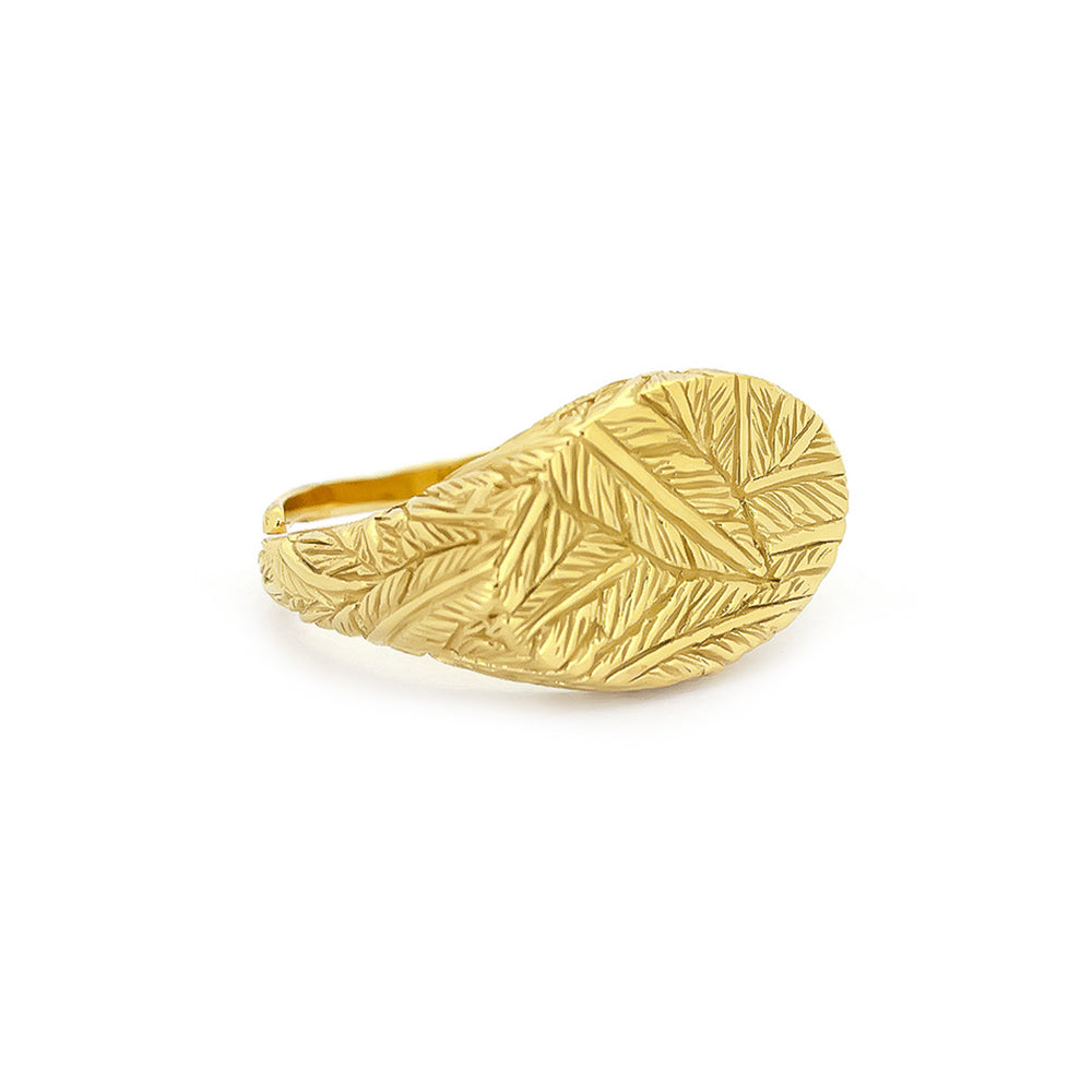 Handcrafted gold ring with distinct textures, featuring a feather pattern.