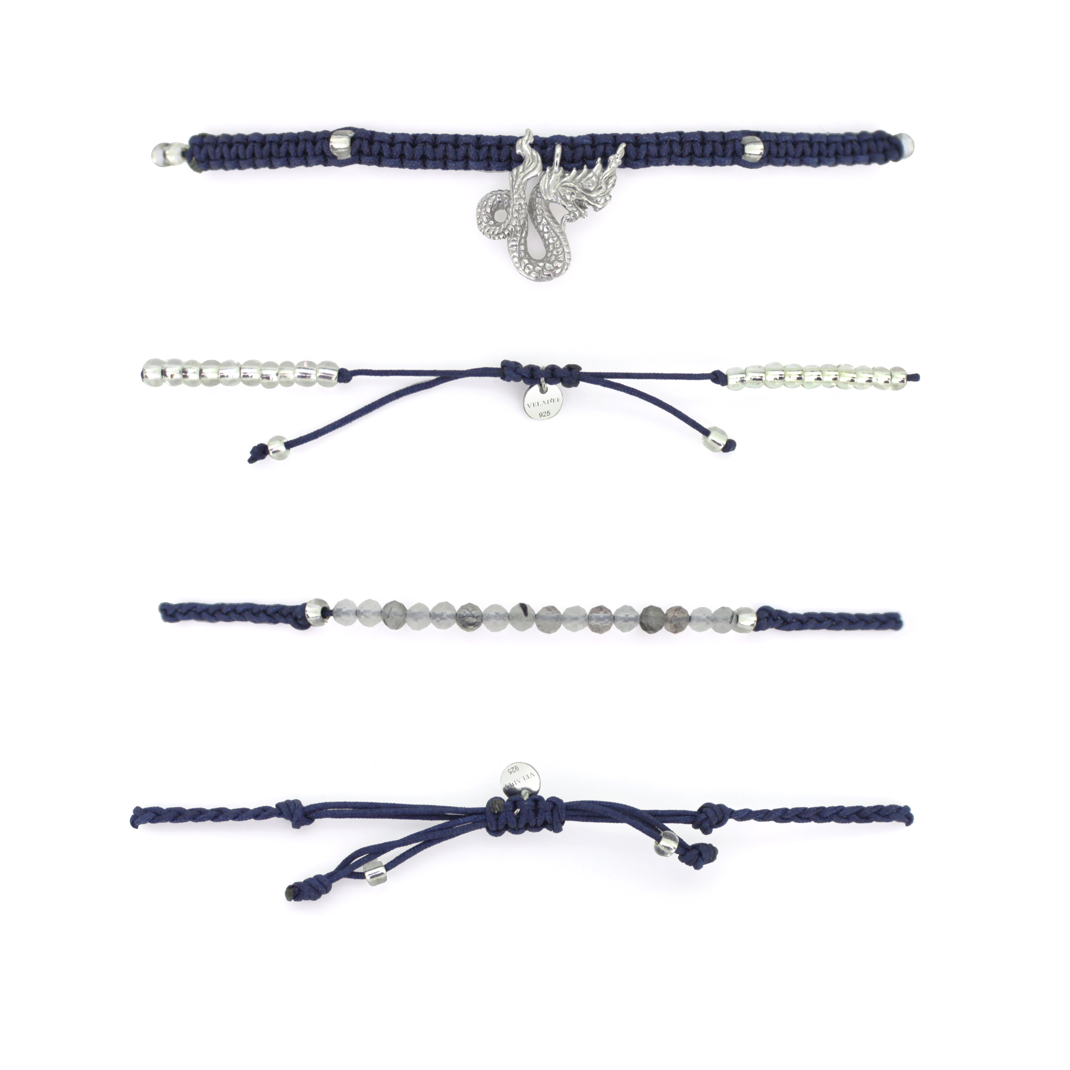 Set of two navy blue bracelets: one with a silver Naga charm, the other with grey quartz-faced beads.