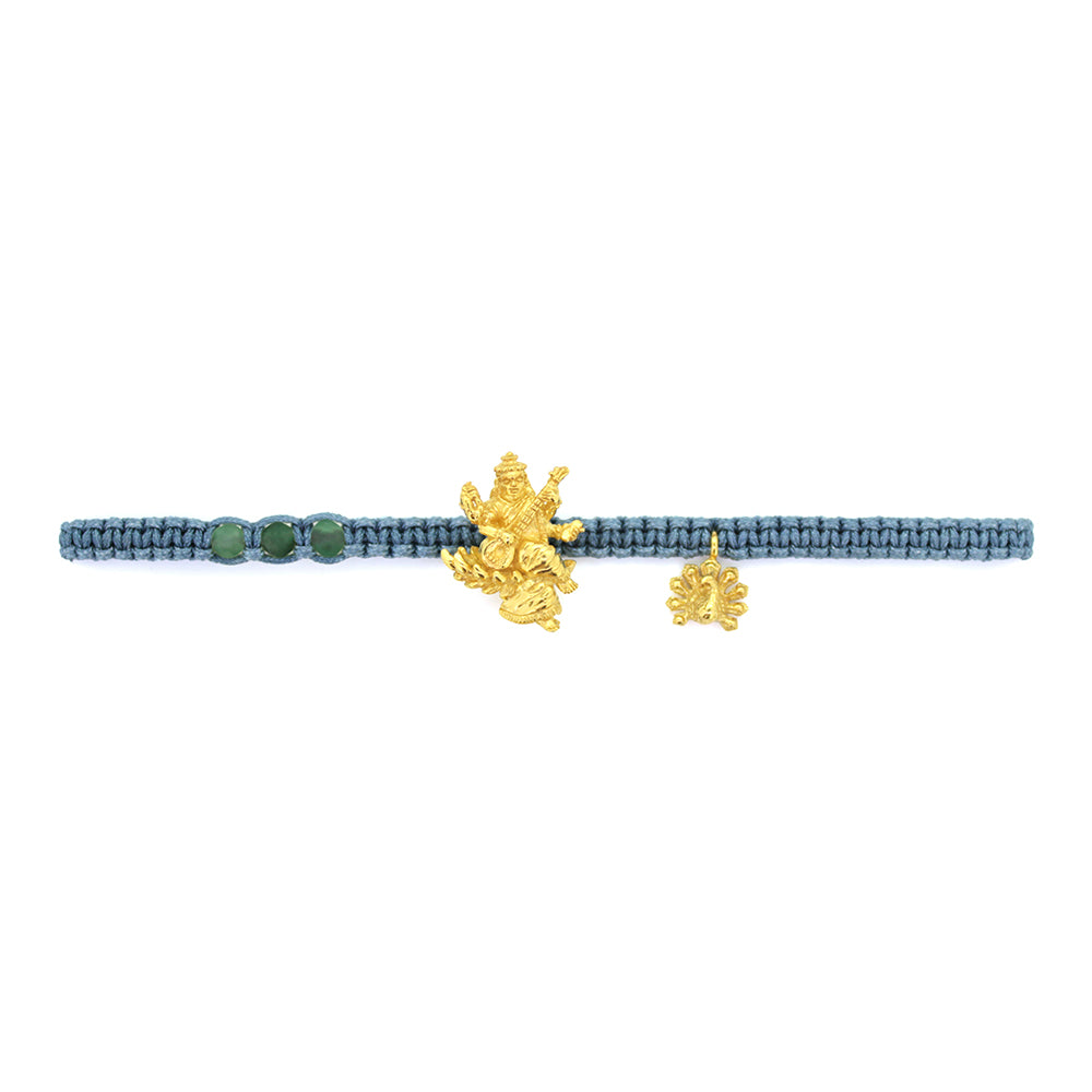 A gold Tridevi Sarasvati charm and a gold peacock charm on a green bracelet with aventurine stone.