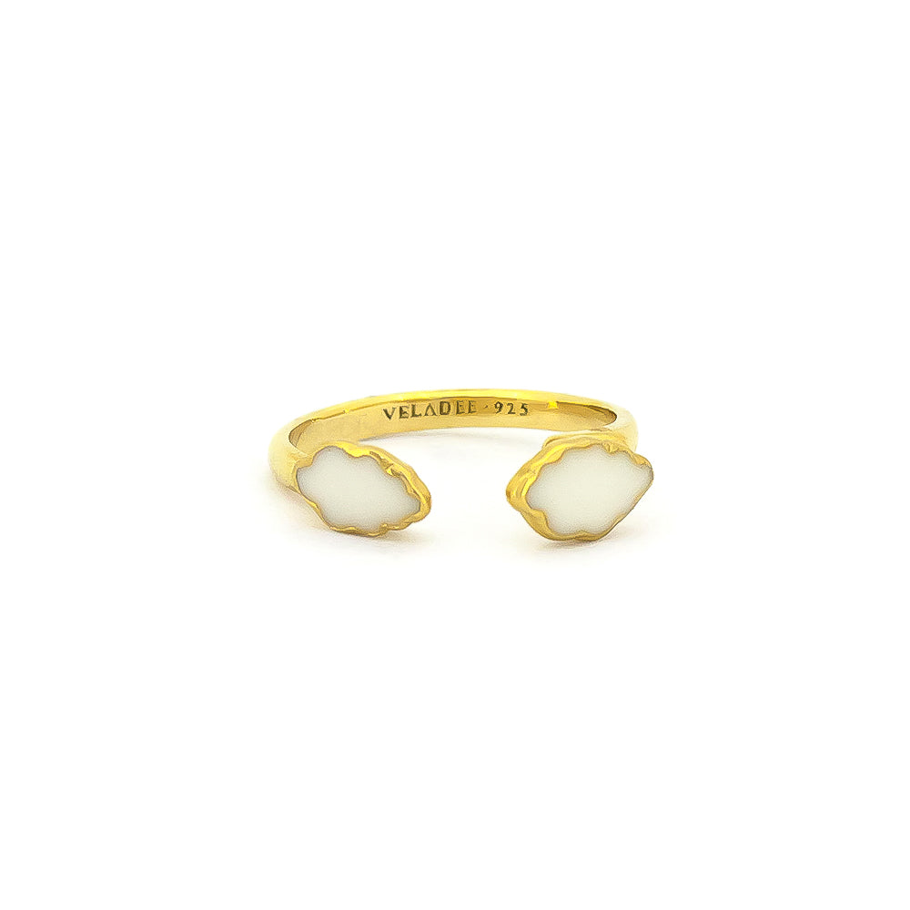 A delicate ring design featuring clouds in gold and white.