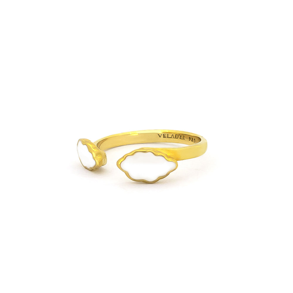 A delicate ring design featuring clouds in gold and white.