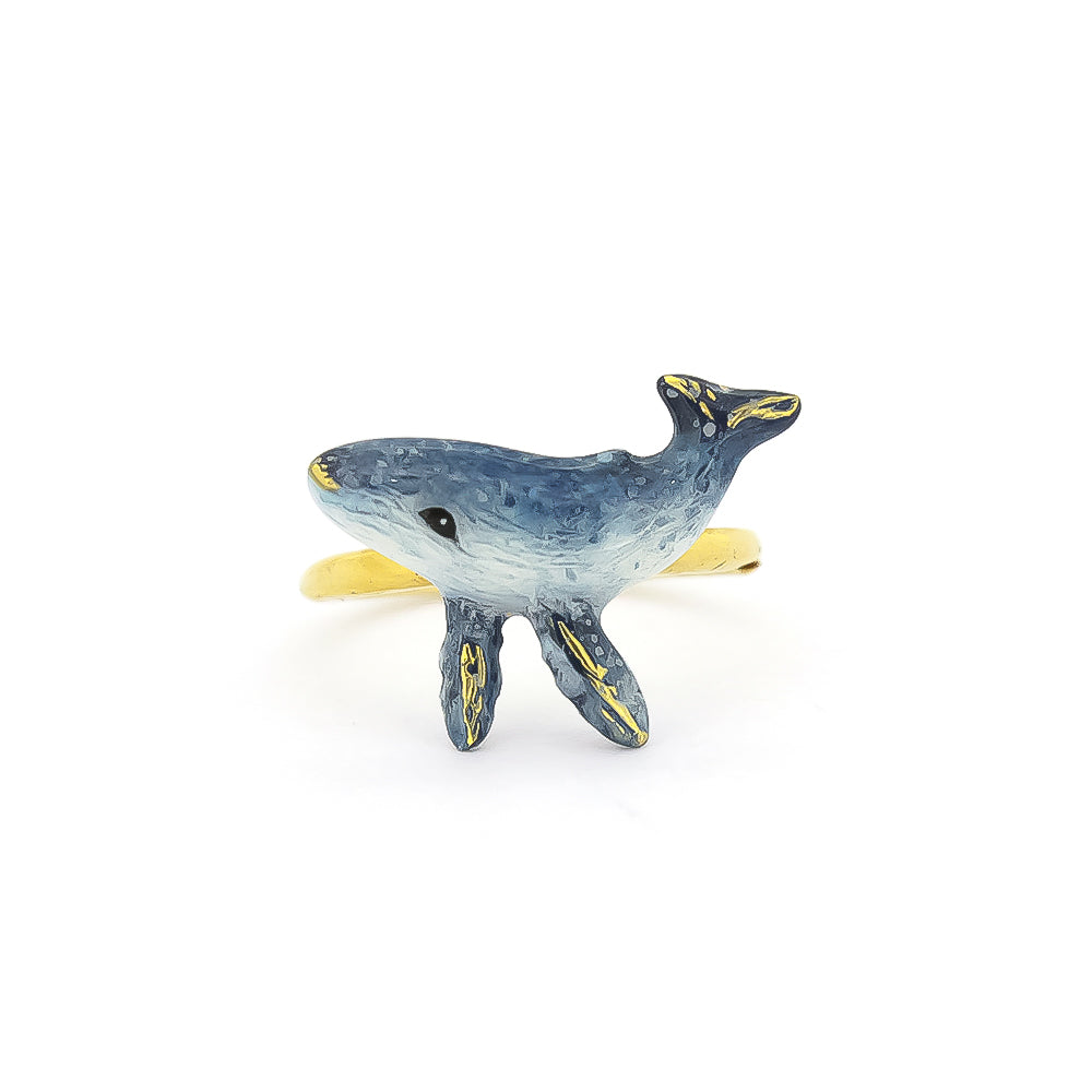 Artistic blue whale ring on a white background