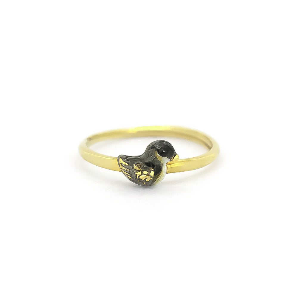 A gold rings featuring unique, intricately designed a baby duck design.