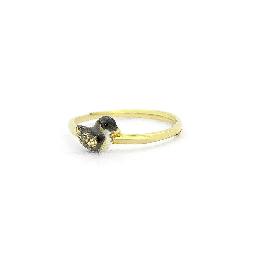 A gold rings featuring unique, intricately designed a baby duck design.