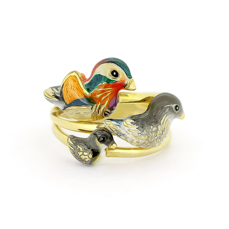 A set of three gold rings featuring colorful, intricately designed mandarin duck motifs in varying sizes.